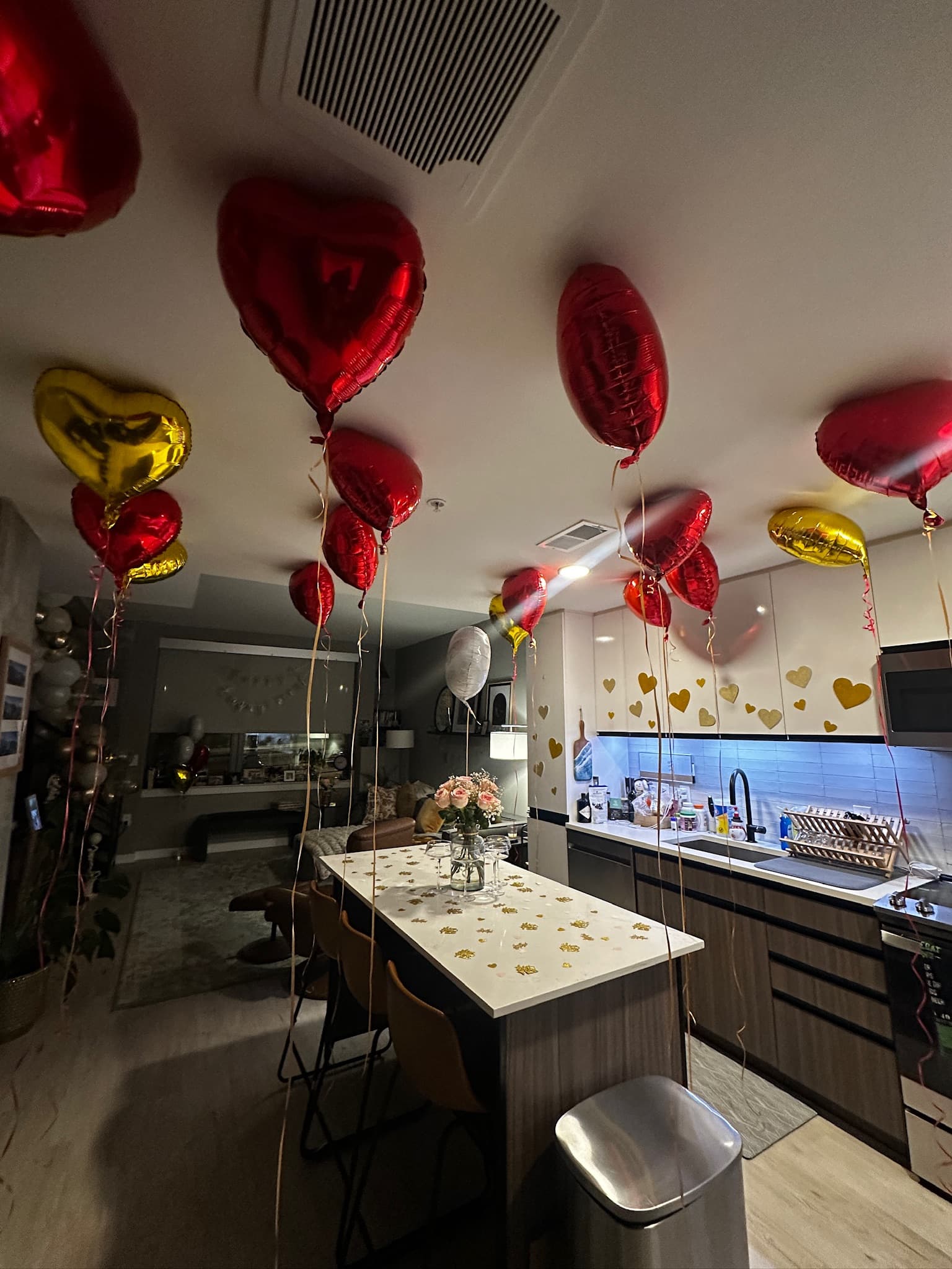 Alternate angle with heart balloons and floral arrangement