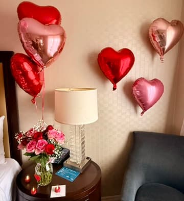 Wide view of suite transformation with LOVE pillows