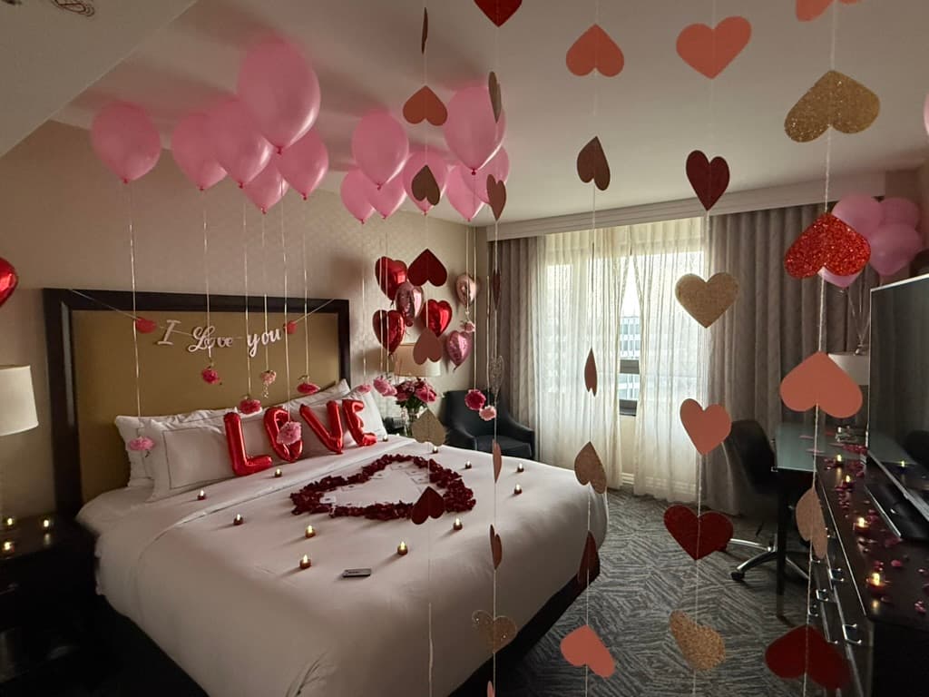 Wide view of anniversary suite with heart garland