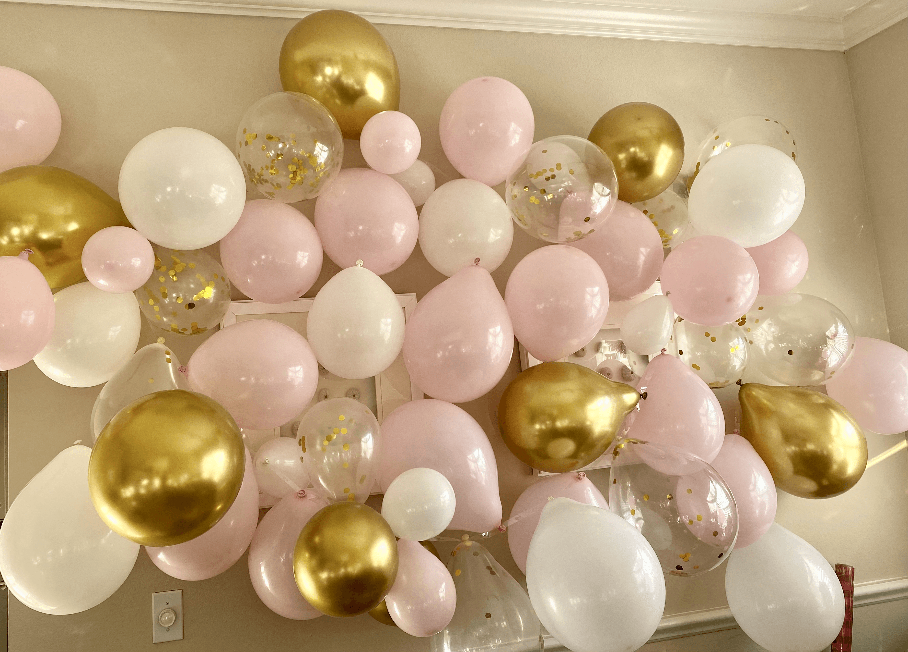 Black and gold balloon display